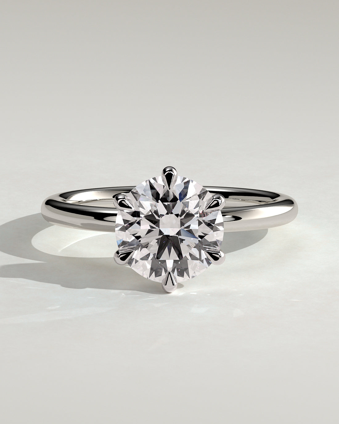 3 carat round center  ring  VS1 . Eye Clean stone IGI certified , handcrafted in 14k gold