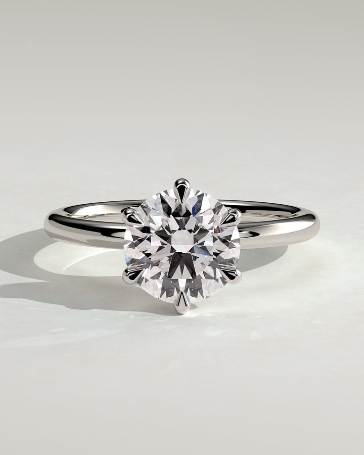 3 carat round center  ring  VS1 . Eye Clean stone IGI certified , handcrafted in 14k gold