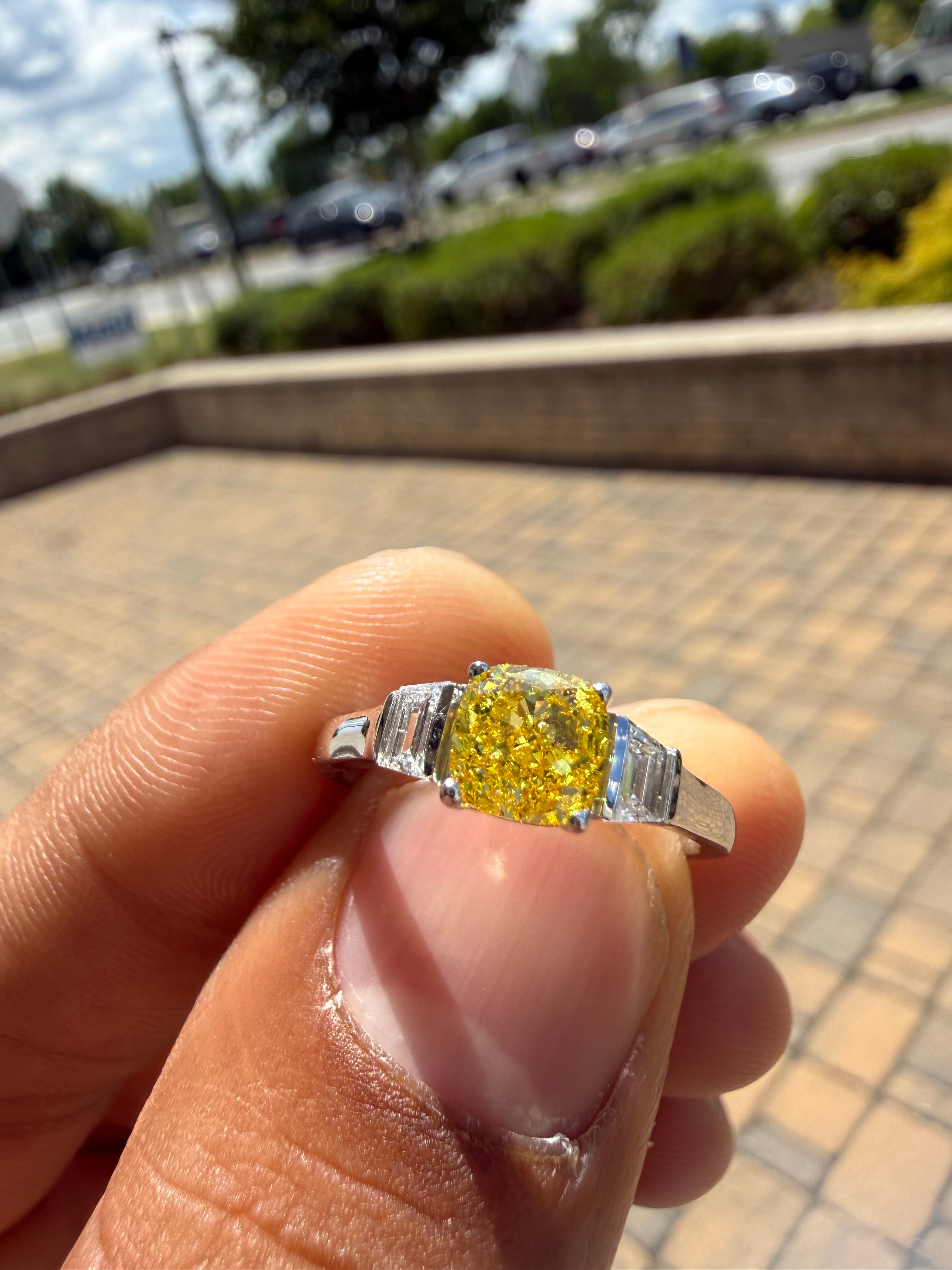 1.5 carat  cushion center stone fancy yellow emerald cut ring in fancy vivid yellow igi certified stone handcrafted in color high cut with  handcrafted ring made with 14k gold in grown diamond igi certified