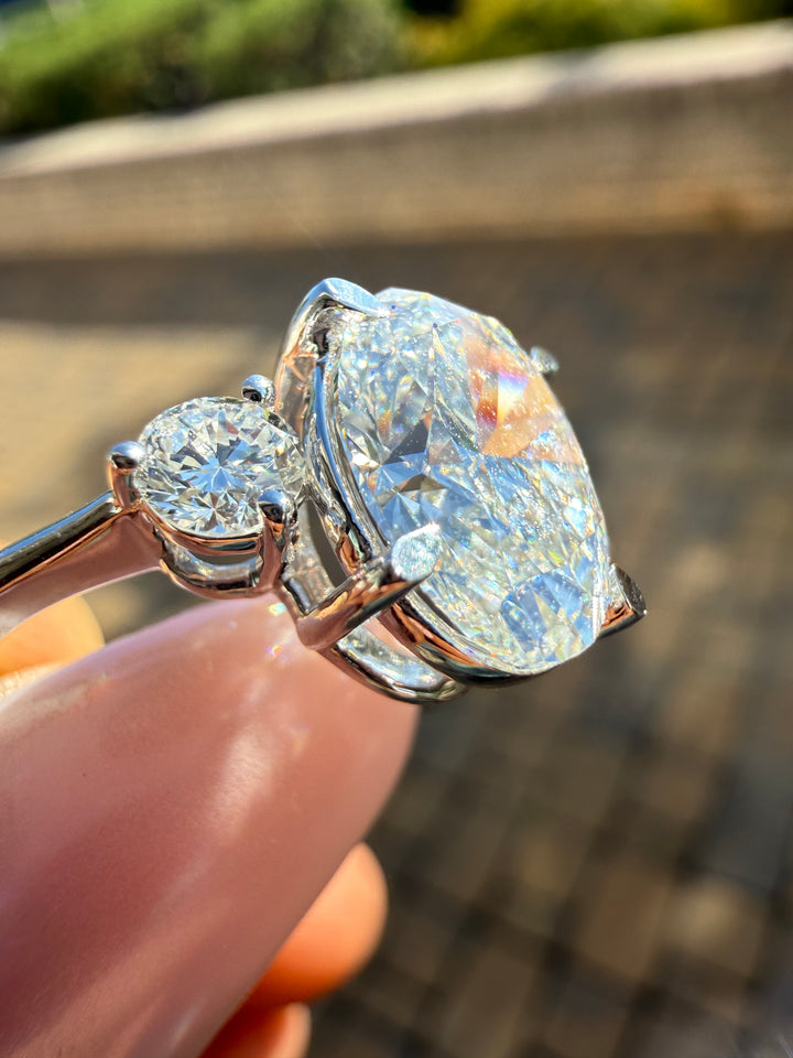 3 carat oval cut ring cut E vs IGI certified 3 carat center stone with special cut on side stone highly handcrafted in grown diamond 14k gold