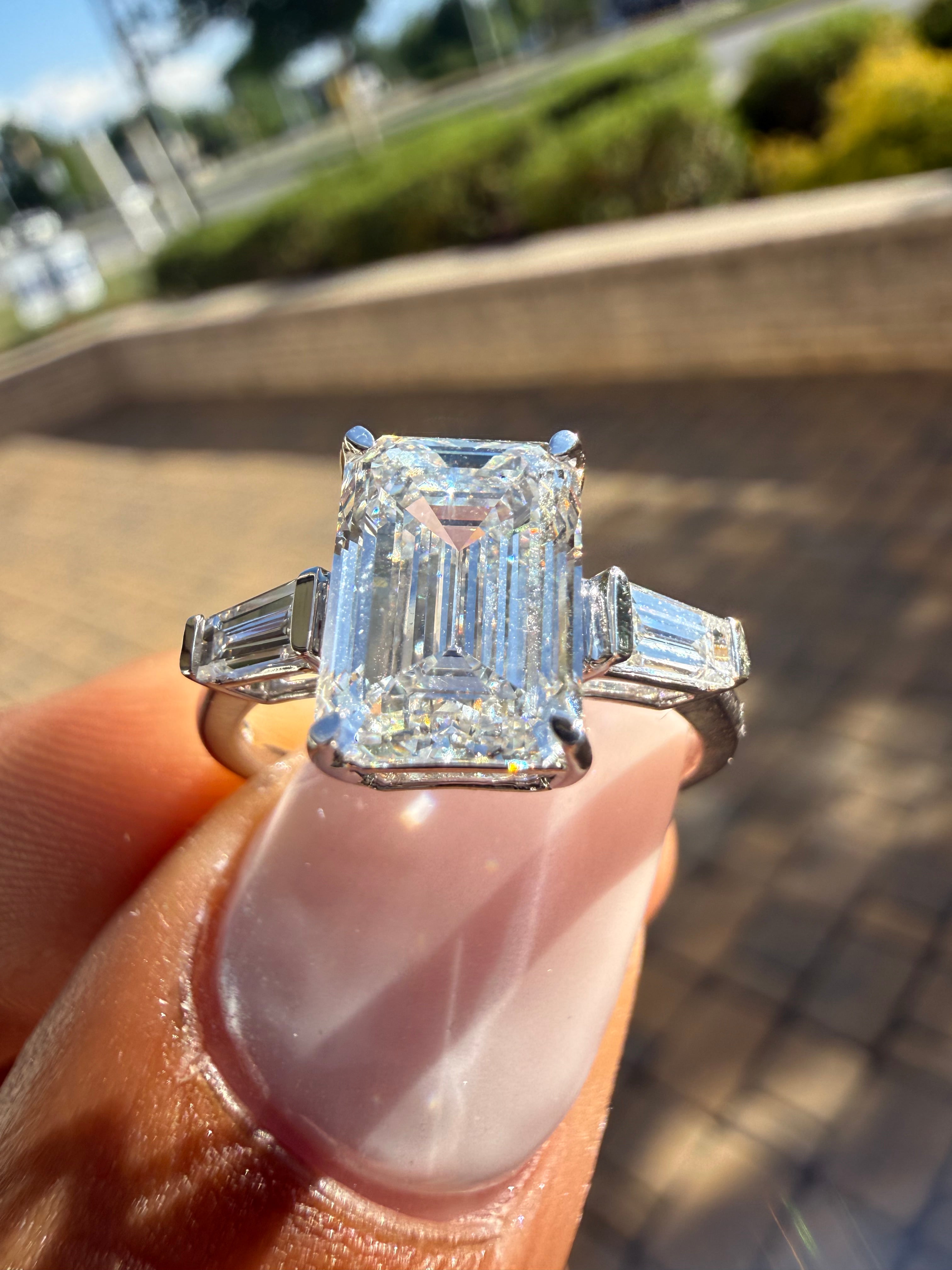 3.75 carat ring emerald cut ring cut E vs IGI certified 3 carat center stone with special cut tapper baguette on side highly handcrafted in grown diamond 14k gold