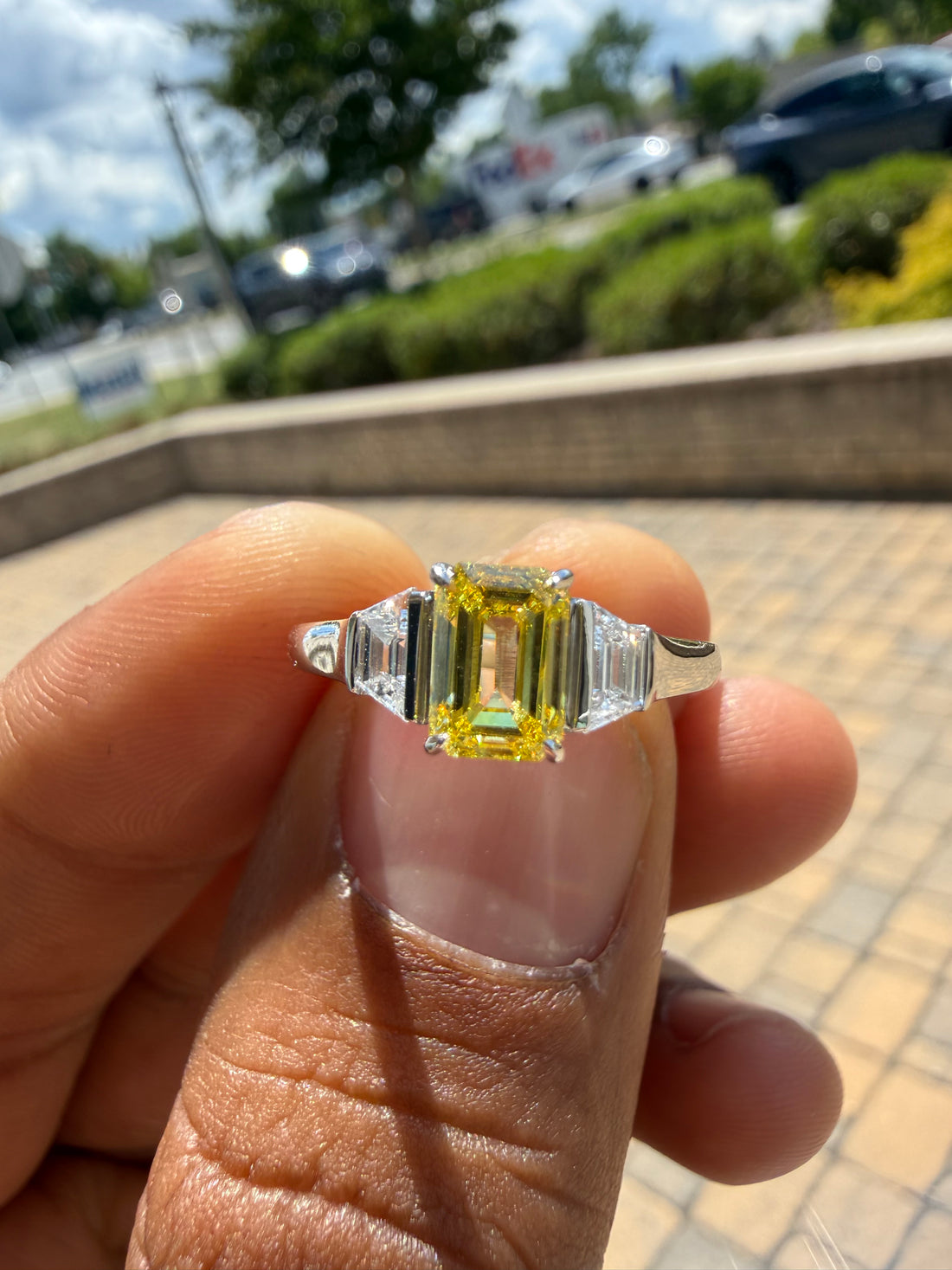 1.5 carat  Emerald cut center stone fancy yellow emerald cut ring in fancy vivid yellow igi certified VS stone with special cut side stones on side handcrafted in color high cut with  handcrafted ring made with 14k gold in grown diamond igi certified