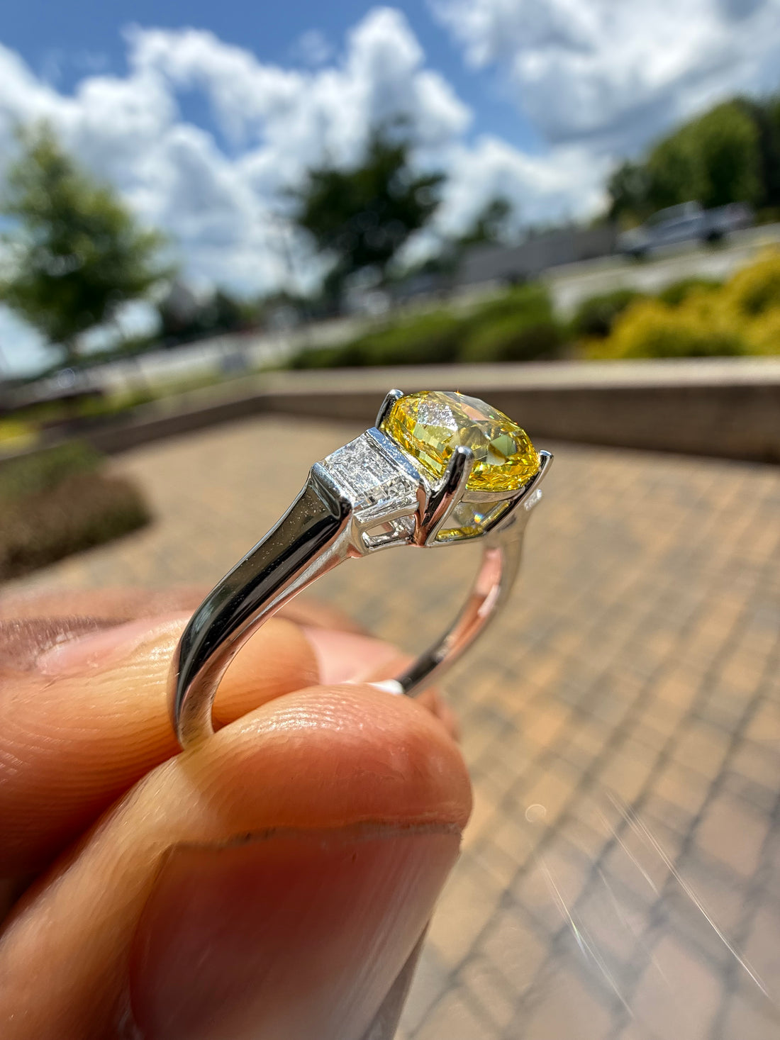 1.5 carat  cushion center stone fancy yellow emerald cut ring in fancy vivid yellow igi certified stone handcrafted in color high cut with  handcrafted ring made with 14k gold in grown diamond igi certified