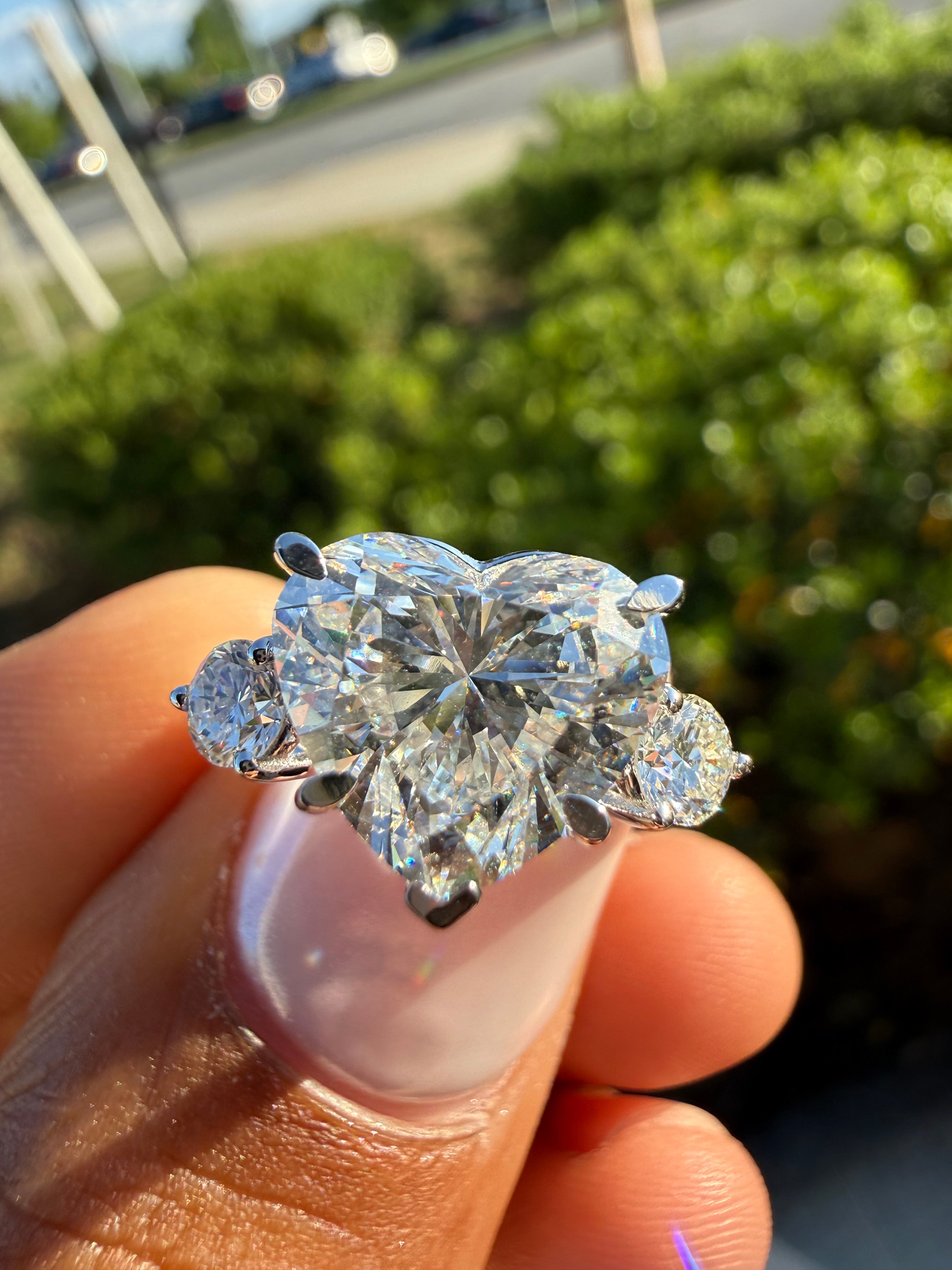 4 carat heart VS  with 3 carat center stone IGI E vs certified with side igi certified special cut ring Vs stone with special stone fancy handcrafted in grown diamond 14k gold ( made in gold ) iGI certified Diamond