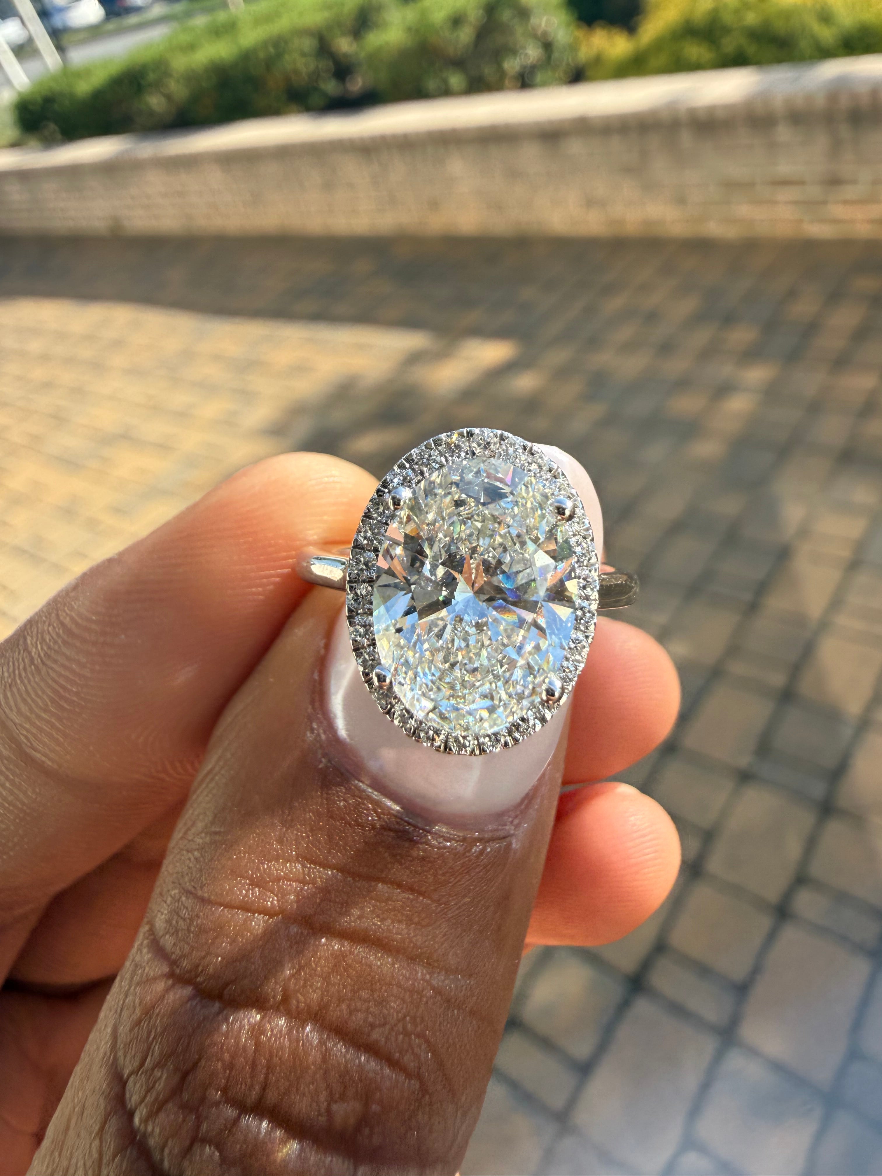3 carat oval cut ring cut E vs IGI certified 3 carat center stone with special cut on side stone highly handcrafted in grown diamond 14k gold