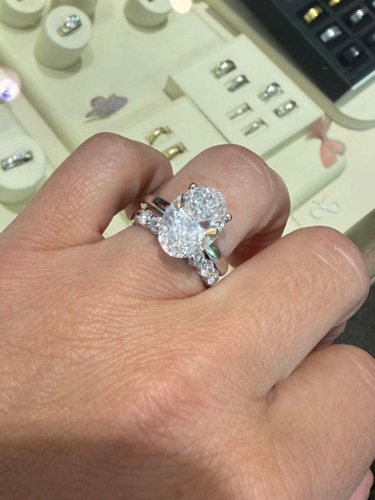 5 carat center oval VS . Eye Clean stone IGI certified , select any shape you want , handcrafted in 14k gold with diamond band full engagement set