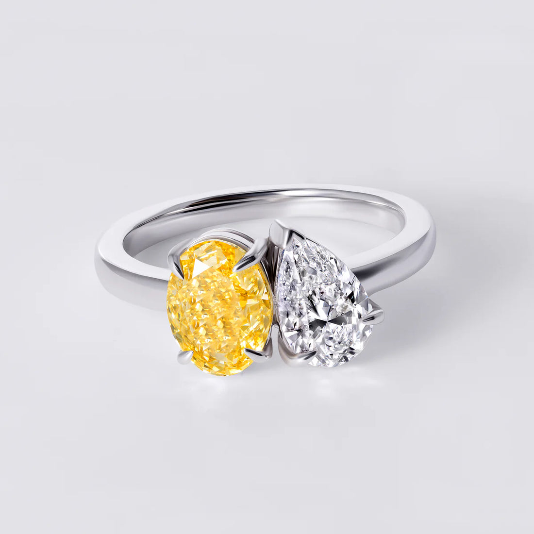 4 carat ring with 2 carat fancy vivid yellow oval & 2 carat pear E vs IGi certified , made with 14k white gold