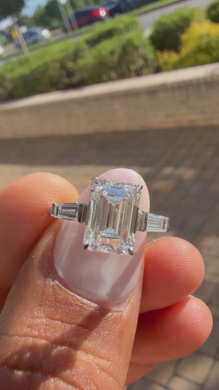 3.75 carat ring emerald cut ring cut E vs IGI certified 3 carat center stone with special cut tapper baguette on side highly handcrafted in grown diamond 14k gold
