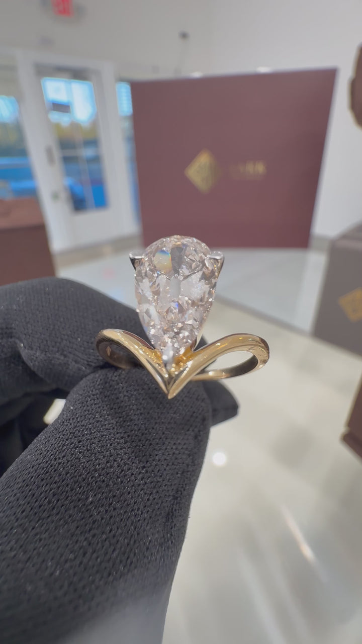3 carat pear E vs handcrafted ring made with 14k gold in igi certified diamond