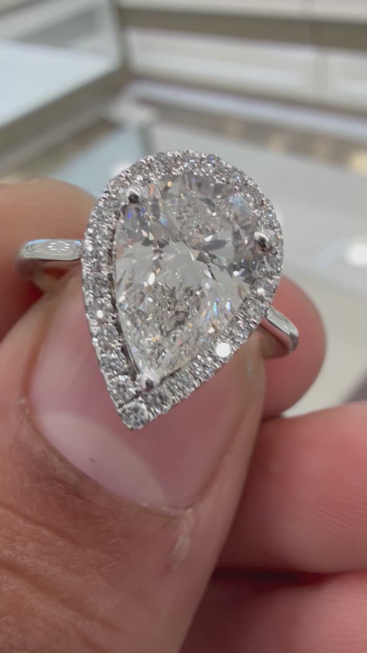 3 carat pear vs Ring handcrafted with round brilliance Diamond made with 14k gold with highest clarity lab grown igi certified