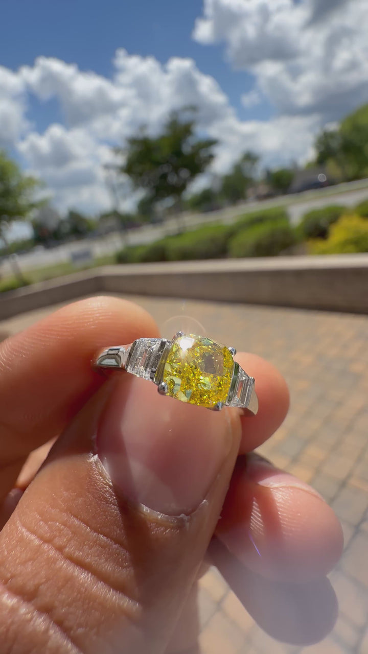 1.5 carat  cushion center stone fancy yellow emerald cut ring in fancy vivid yellow igi certified stone handcrafted in color high cut with  handcrafted ring made with 14k gold in grown diamond igi certified