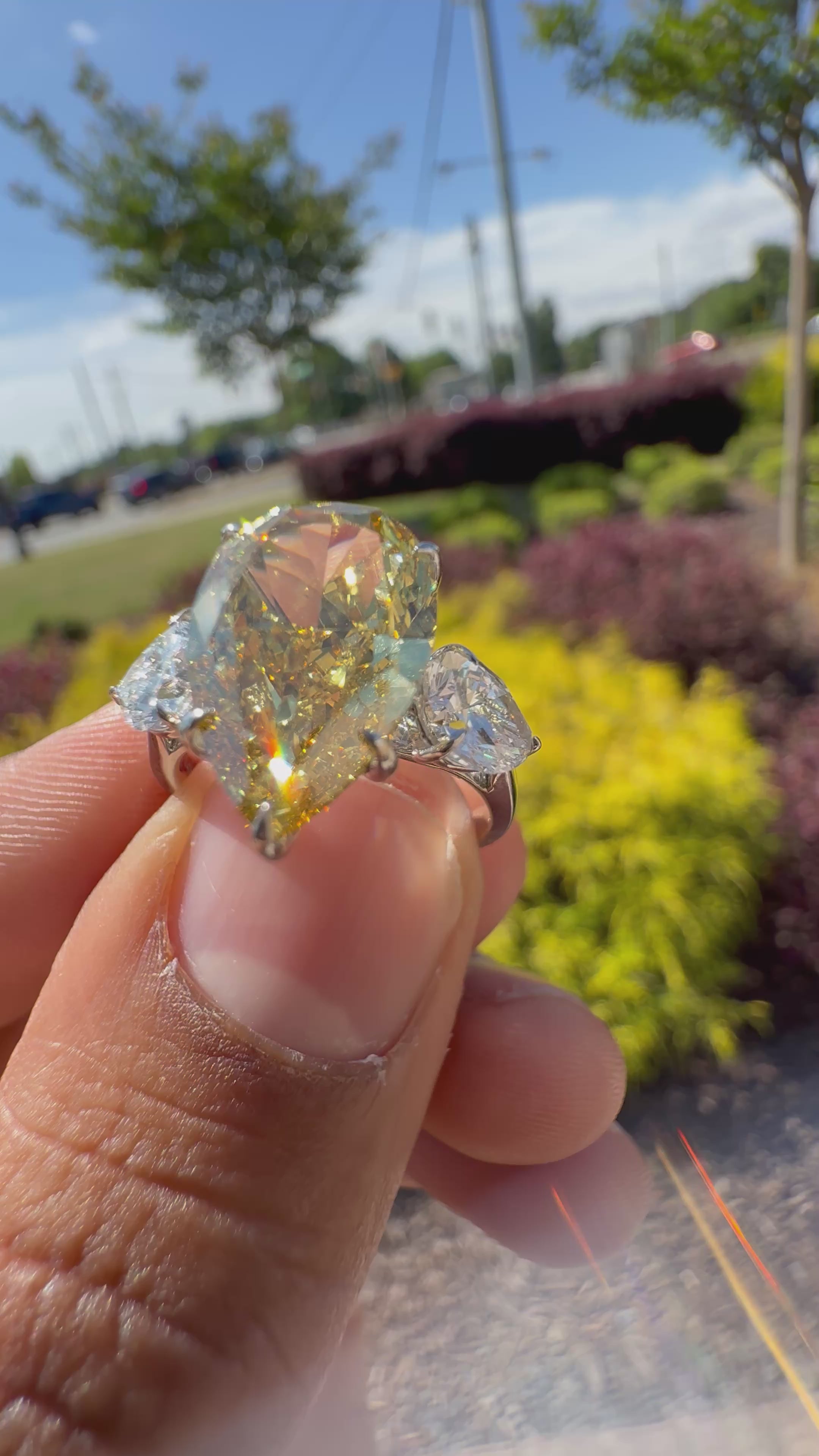 6.5  carat ring with fancy vivid yellow igi certified stone ehandcrafted in color high cut with fancy 2 pear on side stone in  ring handcrafted ring made with 14k gold in grown diamond igi certified
