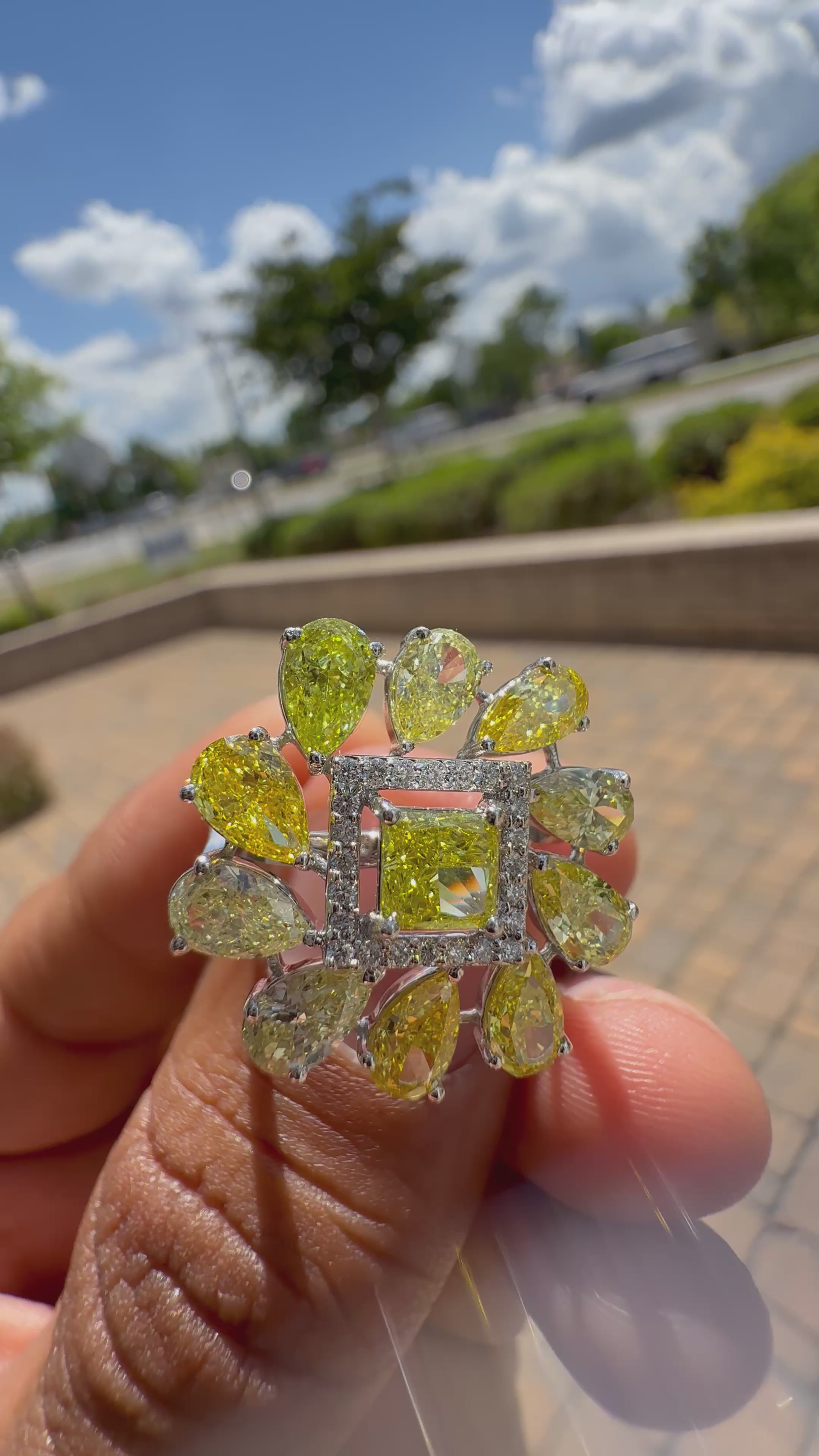 5 carat fancy yellow oval with center princess cut ring in fancy vivid yellow igi certified center stone with special cut side stones on side handcrafted in color high cut with  handcrafted ring made with 14k gold in grown diamond igi certified