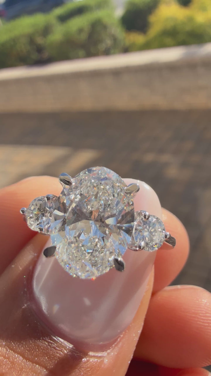 3 carat oval cut ring cut E vs IGI certified 3 carat center stone with special cut on side stone highly handcrafted in grown diamond 14k gold